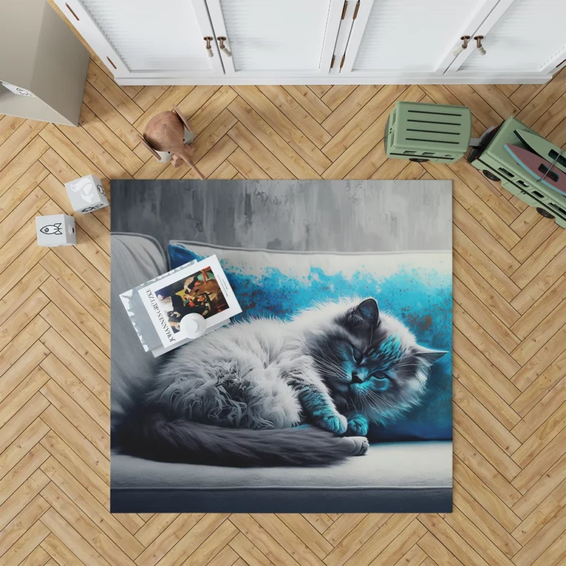 Blue-Eyed Sleeping Cat on Grey Couch Rug