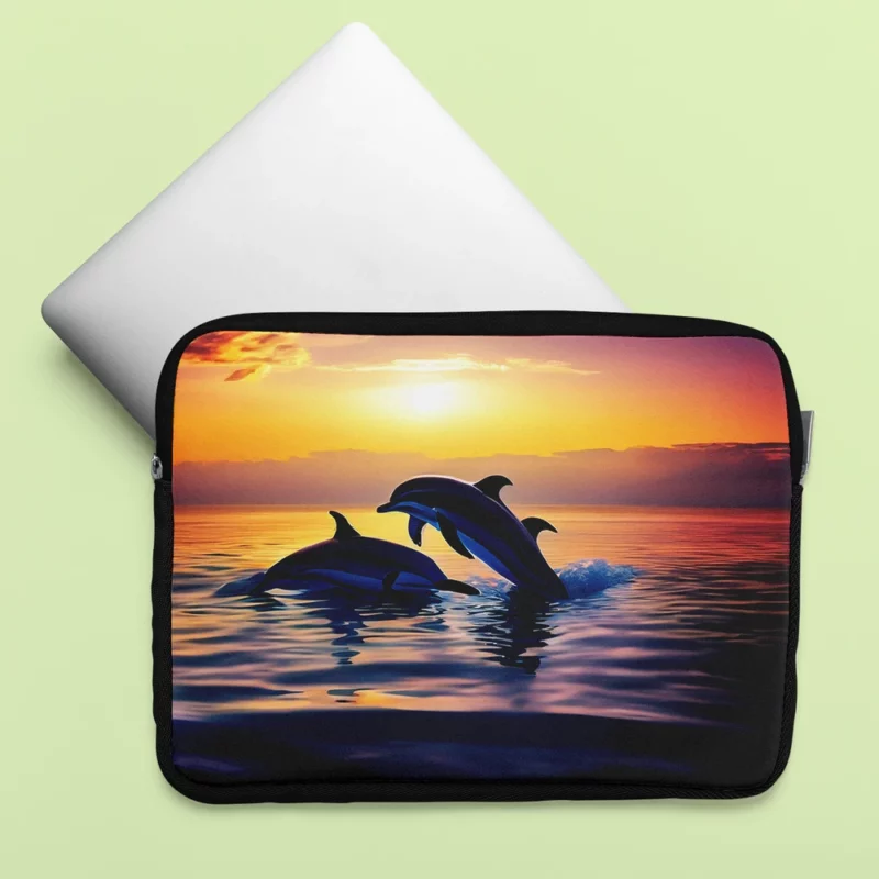 Dolphins Swimming at Sunrise Laptop Sleeve